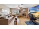 Cozy living room with brick fireplace, ceiling fan, and natural light at 3722 Neptune Dr, Orlando, FL 32804