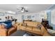 Bright, open living space with hardwood floors, comfortable seating, and seamless flow between living, dining, and kitchen areas at 3722 Neptune Dr, Orlando, FL 32804
