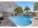 Sparkling pool area with brick pavers, palm trees, covered patio, and ample space for outdoor enjoyment at 3722 Neptune Dr, Orlando, FL 32804