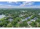 Prime real estate location marked with a green indicator, amidst a vibrant neighborhood with abundant trees at 446 Alberta Dr, Winter Park, FL 32789