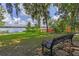 View of backyard overlooking a lake and lush Florida vegetation, a serene escape at 446 Alberta Dr, Winter Park, FL 32789