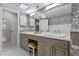 Bright bathroom featuring a dual vanity and walk-in shower at 446 Alberta Dr, Winter Park, FL 32789