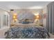 Bedroom with patterned wallpaper, carpet, and a floral bedspread at 446 Alberta Dr, Winter Park, FL 32789