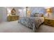 Bedroom with patterned wallpaper, carpet, and a floral bedspread at 446 Alberta Dr, Winter Park, FL 32789