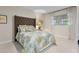 Cozy bedroom with a queen-sized bed, floral bedding, and natural light at 446 Alberta Dr, Winter Park, FL 32789