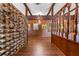 Hallway with hard wood flooring, detailed wooden walls, a decorative brick wall, and elegant lighting at 446 Alberta Dr, Winter Park, FL 32789