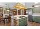 Lovely kitchen featuring a brick-base island and stainless steel appliances at 446 Alberta Dr, Winter Park, FL 32789