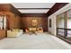Spacious living room with wood accents, large windows, and comfortable seating for Gathering at 446 Alberta Dr, Winter Park, FL 32789