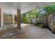 View of a covered patio featuring a brick support column and a fenced in garden at 446 Alberta Dr, Winter Park, FL 32789
