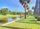 Scenic backyard view with direct access to a canal and a private boat dock at 448 Warrior Trl, Deltona, FL 32725