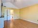 Bedroom featuring laminate floors, a closet, and a bathroom entrance at 448 Warrior Trl, Deltona, FL 32725