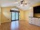 Bedroom with laminate floors and large window offering natural light at 448 Warrior Trl, Deltona, FL 32725