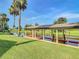 Backyard view of covered dock with swings overlooking the serene waterway at 448 Warrior Trl, Deltona, FL 32725