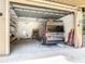 Spacious garage featuring a clear garage door and a van, perfect for storage or hobbies at 448 Warrior Trl, Deltona, FL 32725