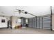 Spacious garage with water heater, overhead storage, and garage door opener at 448 Warrior Trl, Deltona, FL 32725