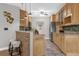 Spacious kitchen featuring light-colored cabinetry and an island with seating at 448 Warrior Trl, Deltona, FL 32725