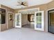 View from the covered lanai looking into the interior of the home through French doors at 448 Warrior Trl, Deltona, FL 32725