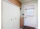 Laundry room with storage and access to the back yard at 448 Warrior Trl, Deltona, FL 32725