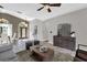 Open-concept living room with tile flooring and lots of natural light at 448 Warrior Trl, Deltona, FL 32725