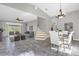 Open-concept living space with tile flooring and a view of the staircase at 448 Warrior Trl, Deltona, FL 32725