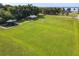 Expansive park with lush green grass, covered picnic areas, and a playground, offering a serene recreational space at 448 Warrior Trl, Deltona, FL 32725