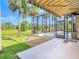 View of the patio and screened-in pool area, perfect for outdoor relaxation at 448 Warrior Trl, Deltona, FL 32725