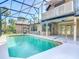 Beautiful pool area with screened enclosure, awning, and well-maintained patio, perfect for outdoor enjoyment at 448 Warrior Trl, Deltona, FL 32725