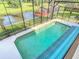 Enclosed pool with crystal clear water and a scenic view of the surrounding landscape at 448 Warrior Trl, Deltona, FL 32725