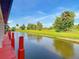 Picturesque waterfront view from the boat dock with a serene canal and surrounding greenery at 448 Warrior Trl, Deltona, FL 32725