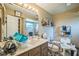 Bathroom with a wooden vanity and large mirror at 4799 Lighthouse Rd, Orlando, FL 32808