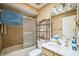 Bathroom featuring a shower/tub combo with glass doors and patterned wallpaper at 4799 Lighthouse Rd, Orlando, FL 32808