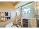 Bathroom with a shower and grab bar at 4799 Lighthouse Rd, Orlando, FL 32808