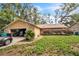 Charming single-story home with a stone facade and well-maintained front yard at 4799 Lighthouse Rd, Orlando, FL 32808