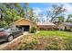 Charming single-story home with a stone facade and well-maintained front yard at 4799 Lighthouse Rd, Orlando, FL 32808