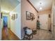 Inviting hallway with tile flooring and wood accents, leading to various rooms in the home at 4799 Lighthouse Rd, Orlando, FL 32808