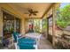 Enjoy the outdoors on this screened patio with a ceiling fan and tile floors, perfect for relaxing or entertaining at 4799 Lighthouse Rd, Orlando, FL 32808