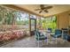 Enclosed porch with tile flooring and ceiling fan overlooking the backyard at 4799 Lighthouse Rd, Orlando, FL 32808