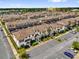 Aerial view of a large community featuring well-maintained townhomes and ample parking at 4802 Lullaby Ln, Kissimmee, FL 34746