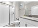 This bathroom features a glass enclosed shower and modern vanity at 4802 Lullaby Ln, Kissimmee, FL 34746