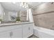 This bathroom features a double vanity, sleek fixtures, and modern finishes throughout at 4802 Lullaby Ln, Kissimmee, FL 34746