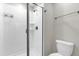 This bathroom boasts a tiled shower with a glass door, enhancing its modern appeal at 4802 Lullaby Ln, Kissimmee, FL 34746