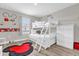 Whimsical bedroom featuring a bunk bed and playful Disney-themed decor at 4802 Lullaby Ln, Kissimmee, FL 34746