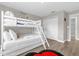 Cozy bedroom featuring a bunk bed, soft lighting, and a serene atmosphere at 4802 Lullaby Ln, Kissimmee, FL 34746