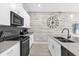 Bright kitchen featuring stainless steel appliances, a modern faucet, and decorative accents at 4802 Lullaby Ln, Kissimmee, FL 34746