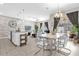 Open concept living space featuring the kitchen, dining area, and living room with pool views at 4802 Lullaby Ln, Kissimmee, FL 34746