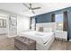 This primary bedroom features a large bed, ample natural light, and a modern aesthetic at 4802 Lullaby Ln, Kissimmee, FL 34746