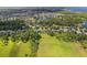 Picturesque aerial view of a residential area near a tranquil lake and verdant landscape at 4951 Parkview Dr, St Cloud, FL 34771
