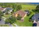 An aerial view of a single-Gathering home with screened pool and lush landscaping near a scenic lake at 4951 Parkview Dr, St Cloud, FL 34771
