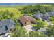 Aerial view of a property featuring a screened pool, landscaping, and a nearby lake at 4951 Parkview Dr, St Cloud, FL 34771