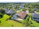 Overhead view of a single-Gathering home with a screened pool, patio, and green lawn at 4951 Parkview Dr, St Cloud, FL 34771